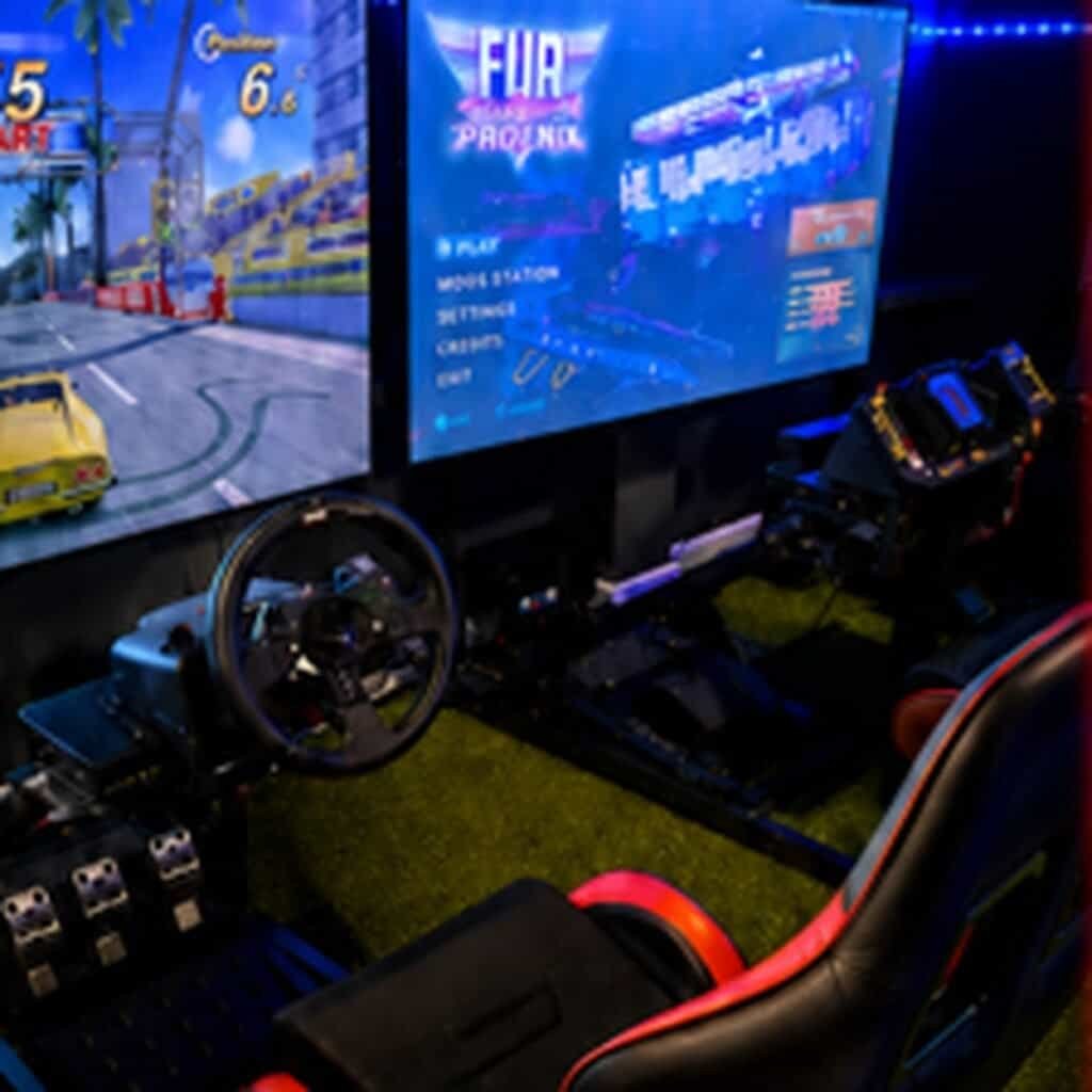 Racing arcade game setup at Arcade Time Machine in Stockton-on-Tees.